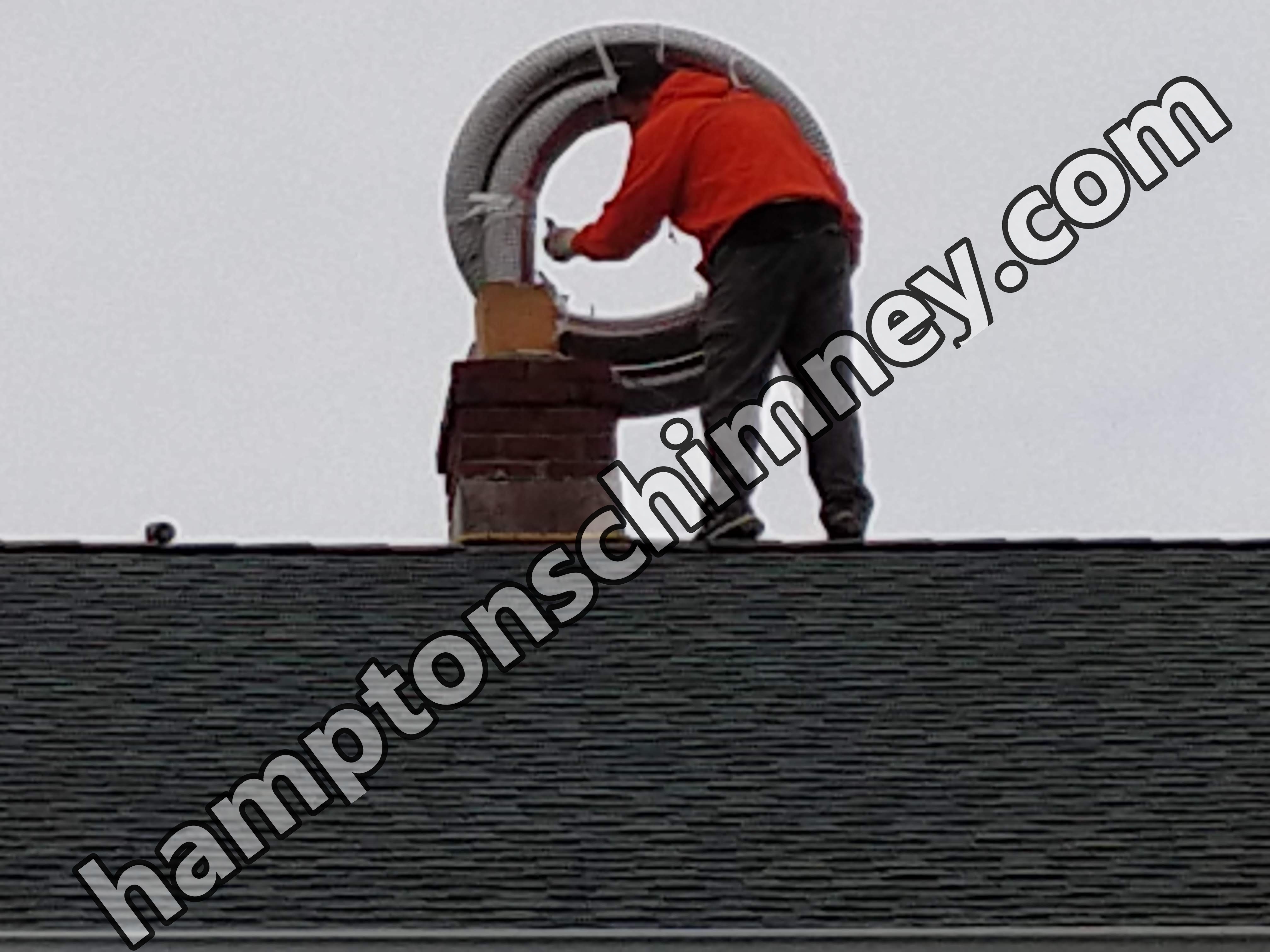 Flexible stainless chimney liner being installed in The Hamptons, New York